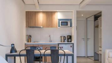 Mini-fridge, microwave, cookware/dishes/utensils