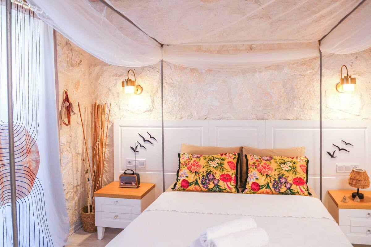 Premium bedding, desk, laptop workspace, iron/ironing board
