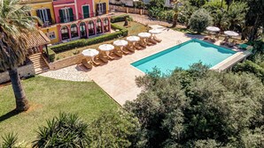 A large villa with a swimming pool, sun loungers, and a view of the surrounding landscape. - Ionian Arches Corfu (Corfu)