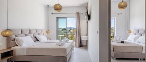 Ein modernes Schlafzimmer mit einem großen Bett, Nachttischen, einem Fernseher und einem Balkon mit Blick.