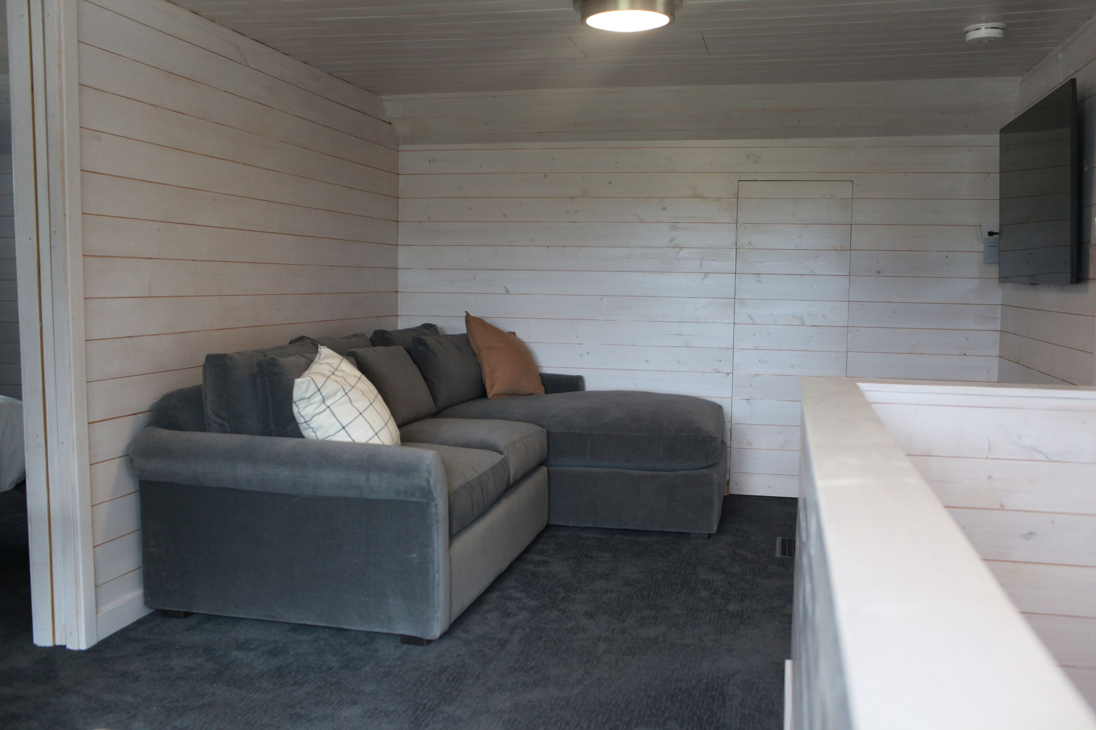 Need a break from adventure? This comfy Room and Board couch and 60" TV will do.