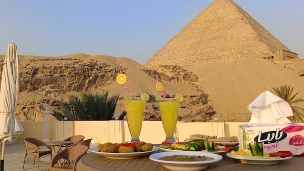 Unclassified image, 1 of 15, button - Crystal pyramids inn (Giza)