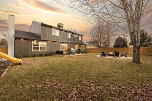 A modern house with a deck, a fire pit, and a slide. - Beautiful modern home in Arvada (Arvada)