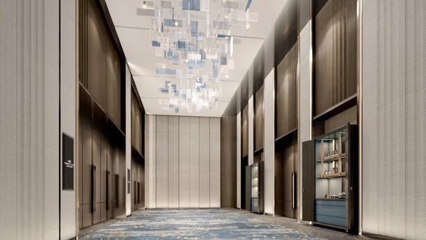 A modern hotel corridor with a patterned floor, large windows, and a ceiling with geometric light fixtures. - Crowne Plaza Shangluo (Shanglou)