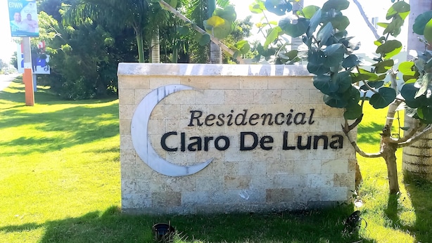 A sign for 'Residencial Claro De Luna' with a crescent moon design. - Beautiful Villa in Cabarete Puerto Plata .walking Distance to the beach . (Cabarete)