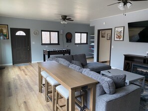 Smart TV, fireplace, foosball