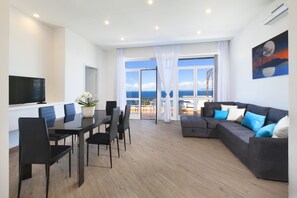 Panoramic Apartment, Balcony, Sea View | Living area | 32-inch flat-screen TV with digital channels - YourHome - Tramonto sul Golfo Apartment (Sorrento)