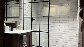 Shower, eco-friendly toiletries, towels, soap