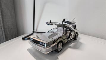 A model car on a white surface.