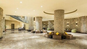 A spacious lobby with a marble floor, large columns, and a staircase. - Copthorne Makkah Al Naseem (Makkah)