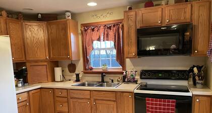 Rural cozy and quaint farmhouse with secluded patio and 15 minute drive to town.