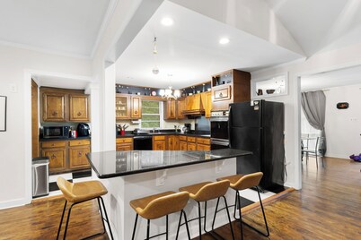 Spacious open floor plan. 5 beds. 5 TVs. & Art.