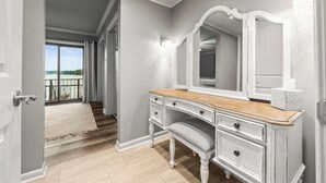 A room with a vanity, a mirror, and a view of a balcony. - Cozy Lakefront Condo, 2BR/2BA Retreat (Hot Springs)