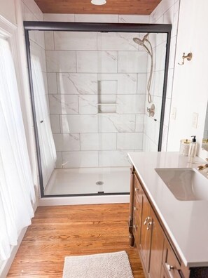 Shower, towels, soap, toilet paper
