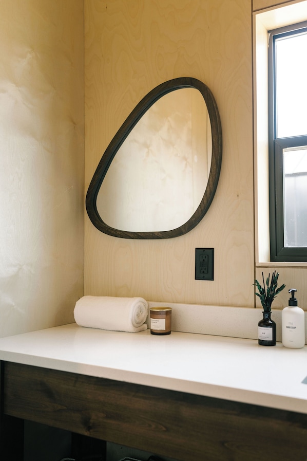 Shower, designer toiletries, hair dryer, bathrobes