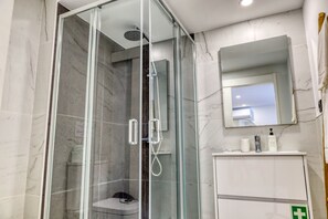 Shower, hair dryer, towels, soap