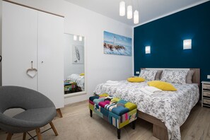 1 bedroom, desk, iron/ironing board, travel crib