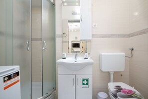 Shower, hair dryer, towels, soap