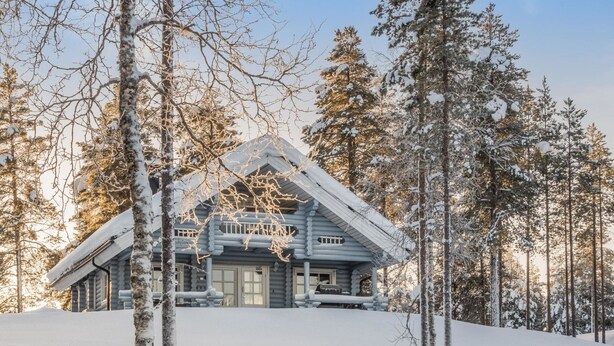 A log cabin surrounded by snow-covered trees. - Puljunharju by Interhome (Sodankylä)