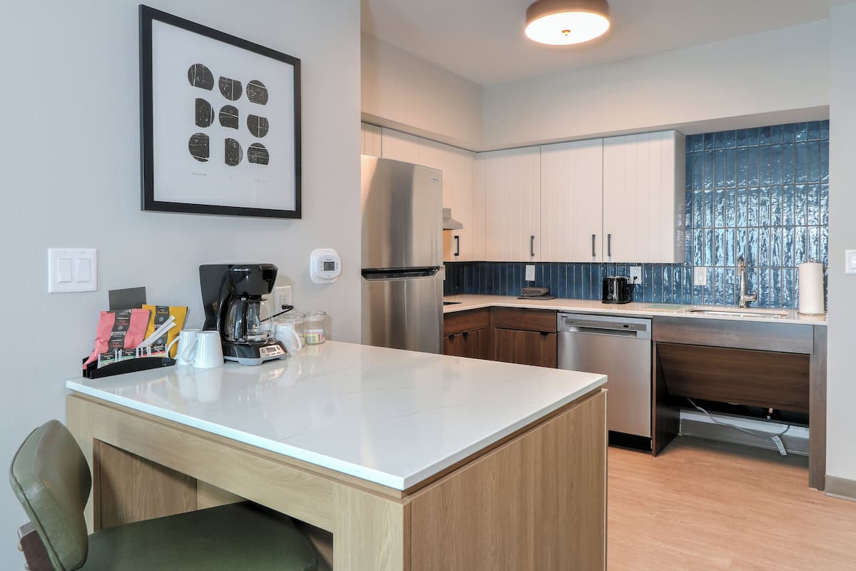 Hypo-allergenic bedding, desk, laptop workspace, blackout drapes