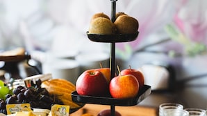 A buffet table with various food items including fruits, cheeses, and vegetables. - Faaker See Inn (Finkenstein am Faaker See)