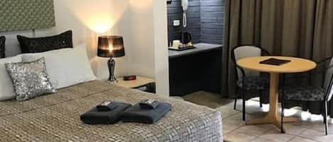 Deluxe Room, 1 Queen Bed | Individually furnished, desk, laptop workspace, blackout drapes