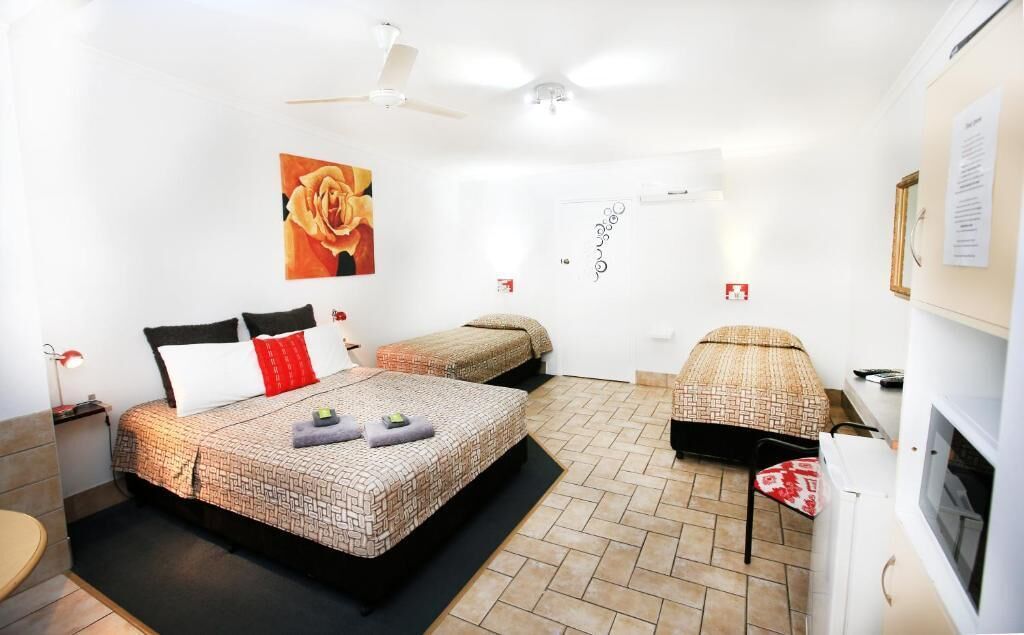 Deluxe Room, Multiple Beds | Individually furnished, desk, laptop workspace, blackout curtains