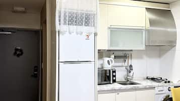Fridge, electric kettle, cookware/dishes/utensils