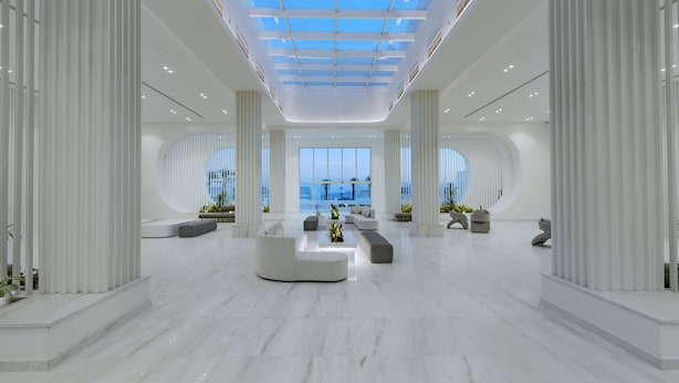 A spacious lobby with a high ceiling, large windows, and modern seating arrangements. - White Hills Resort - Posh Club (Sharm El Sheikh)