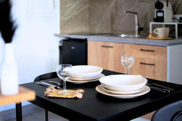 Enjoy a well-equipped kitchen with a coffee machine and ample space for dining and food preparation.