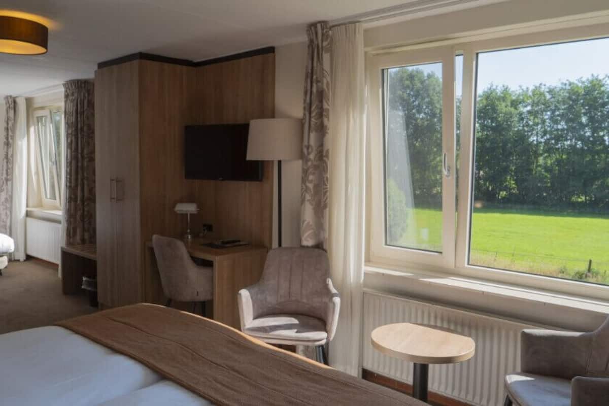 Habitación Deluxe | 1 dormitorio, ropa de cama de alta calidad, escritorio y cunas (de pago)