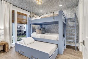 A bunk bed room with a ladder, a window with blinds, and a view of the outside. - Luxe Downtown Home • Rooftop • Fireplace • DT ~2m (Nashville)