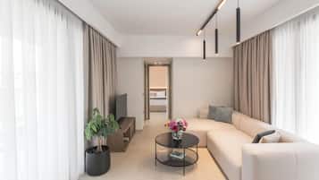 Superior Suite, City View | Living area | 32-inch flat-screen TV with satellite channels