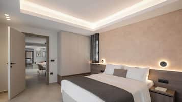A modern bedroom with a large bed, bedside tables, and a built-in wardrobe.