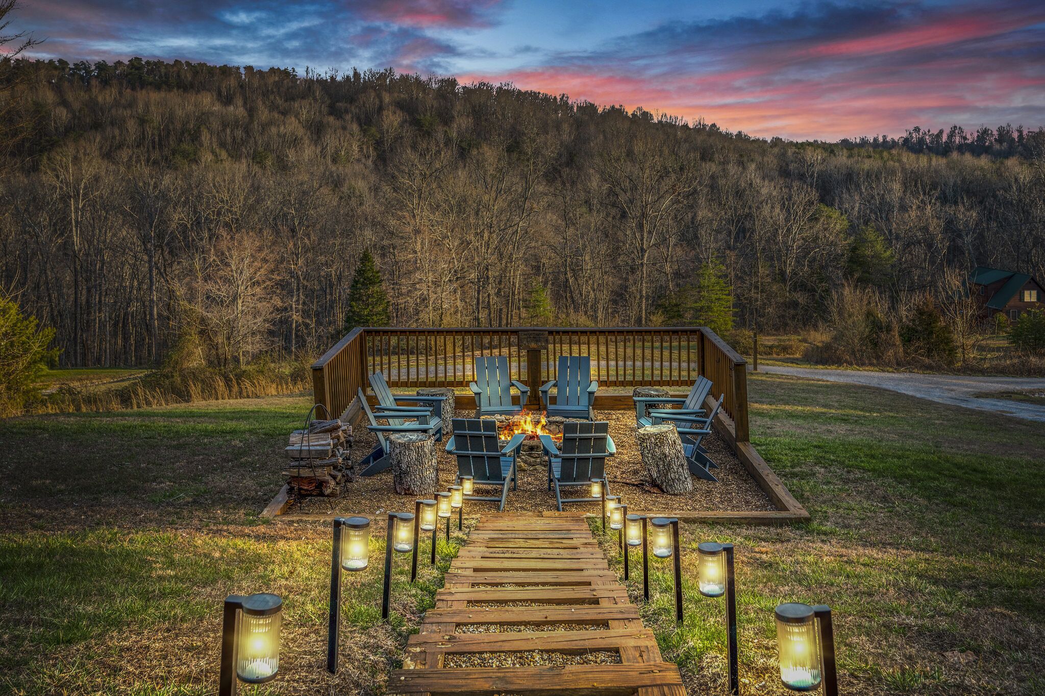 Evening vibes around the fire pit. Solar powered lights illuminate the walkway.