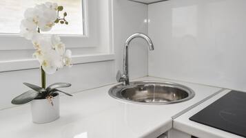 Fridge, stovetop, electric kettle, toaster