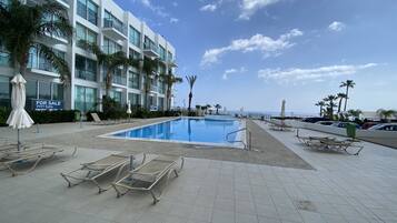 Seasonal outdoor pool, pool loungers