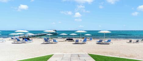 On the beach, sun-loungers