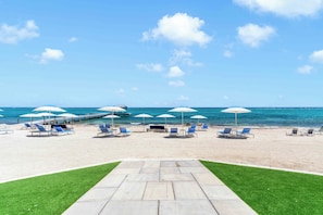 On the beach, sun-loungers