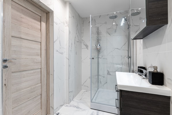 Shower, eco-friendly toiletries, hair dryer, towels
