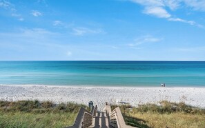 A wooden boardwalk leading to a beach with a clear sky. - Cozy Home by Seaside, Pool & Spa, Fire Pit + Bikes (Santa Rosa Beach)