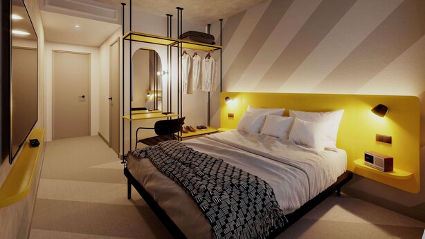 Een moderne slaapkamer met een bed, een kaptafel met spiegel en een televisie.