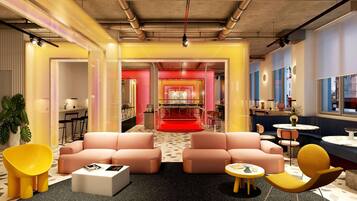 Un espace de détente moderne comprenant des sièges, un bar et un coin repas.
