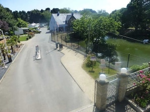 Stroll along the serene street lined with lush greenery and enjoy the tranquil atmosphere.