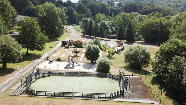 Enjoy tennis and playtime in our fenced tennis court surrounded by play structures and a clubhouse.