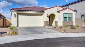 A single-story house with a garage, a red-tiled roof, and a small front yard with landscaping. - 5 Mi to Westgate! Newly Built Family Retreat (Glendale)