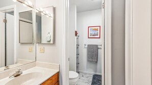 A bathroom with a sink, mirror, and toilet. - Cozy Sea Pines Getaway! Features Community Pool and Short Walk to The Beach. (Bethany Beach)