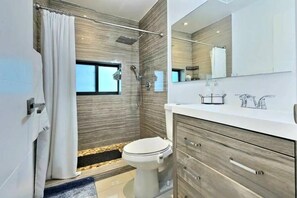 Shower, hair dryer, towels, soap