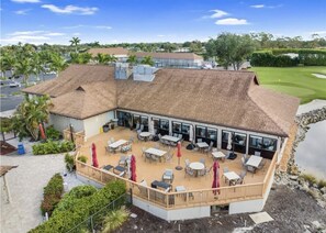 Outdoor dining - Superior Views, Golf, Pickleball & More! Beautiful 2-bedroom condo in Naples! (Naples)