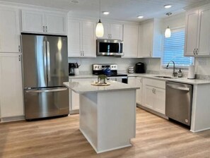 Fridge, microwave, oven, stovetop - 7 Bedroom 2 Floor Canal Home Steps from the Beach! (Holden Beach)